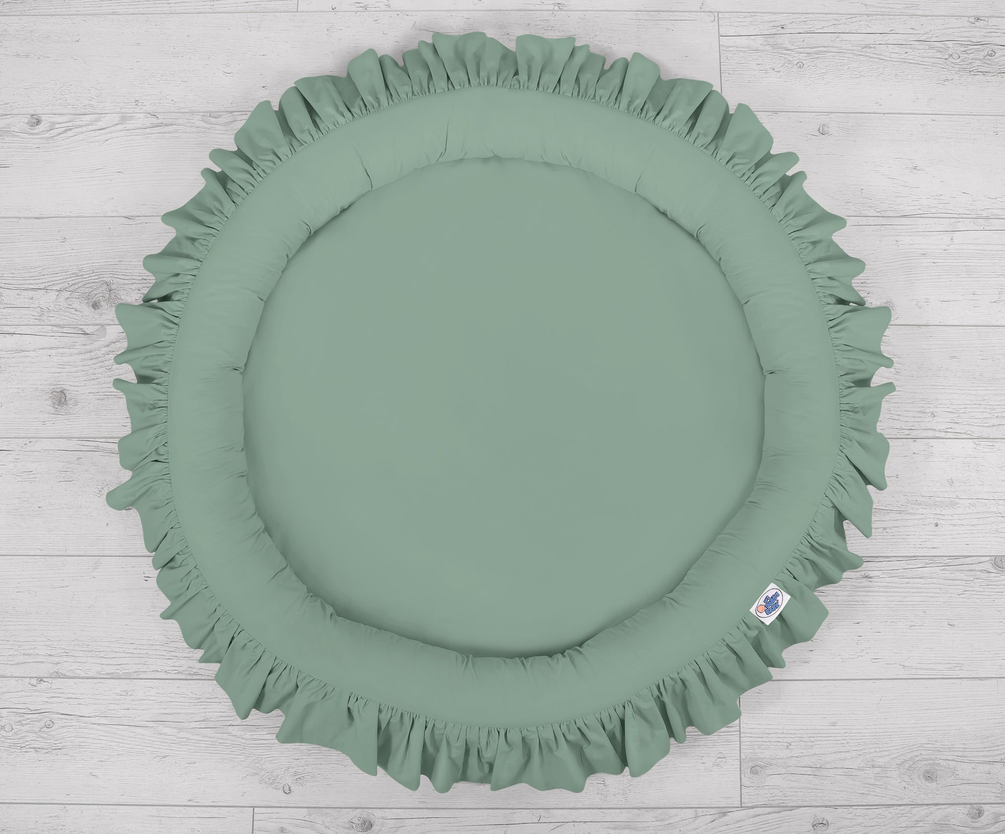 Nest with flounce - pastel green
