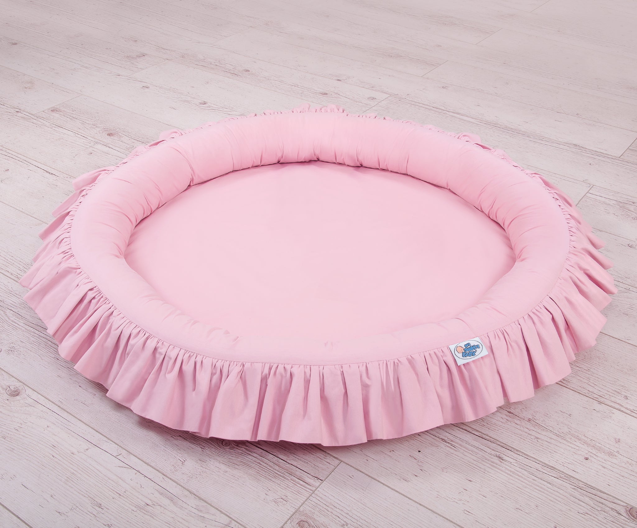Nest with flounce - pink