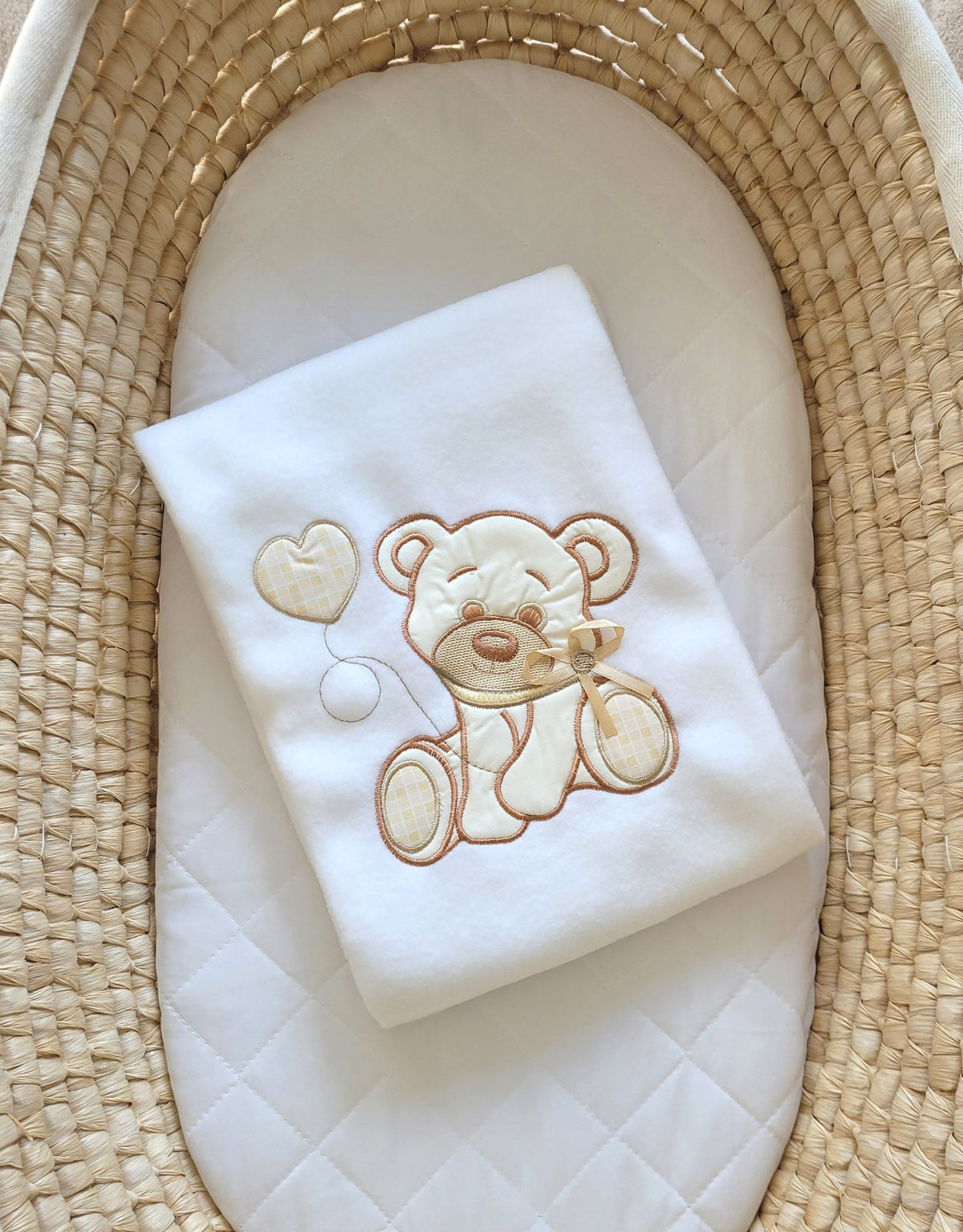 White polar fleece baby blanket with bear and bow